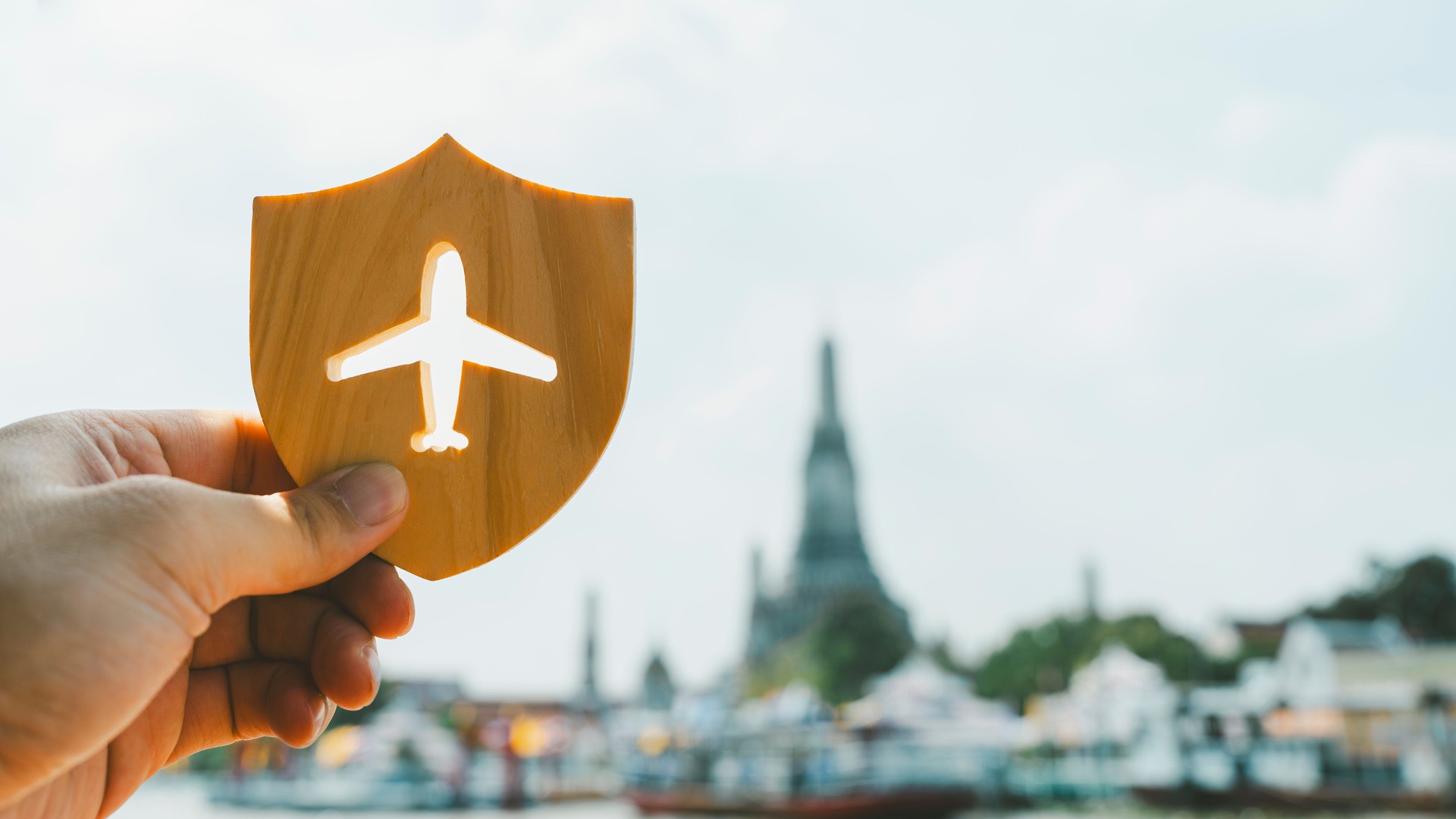 Shield protect icon with plane icon, Security protection. The concept of travel insurance, covering medical expenses, emergency medical evacuation, trip delays, trip interruptions, and lost baggage.